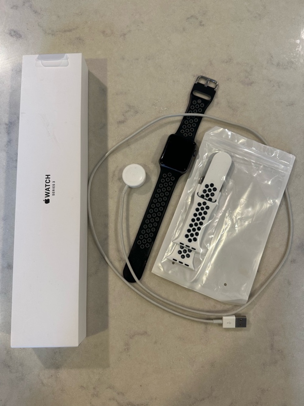 Apple Watch with Black and White Perforated Sport Bands